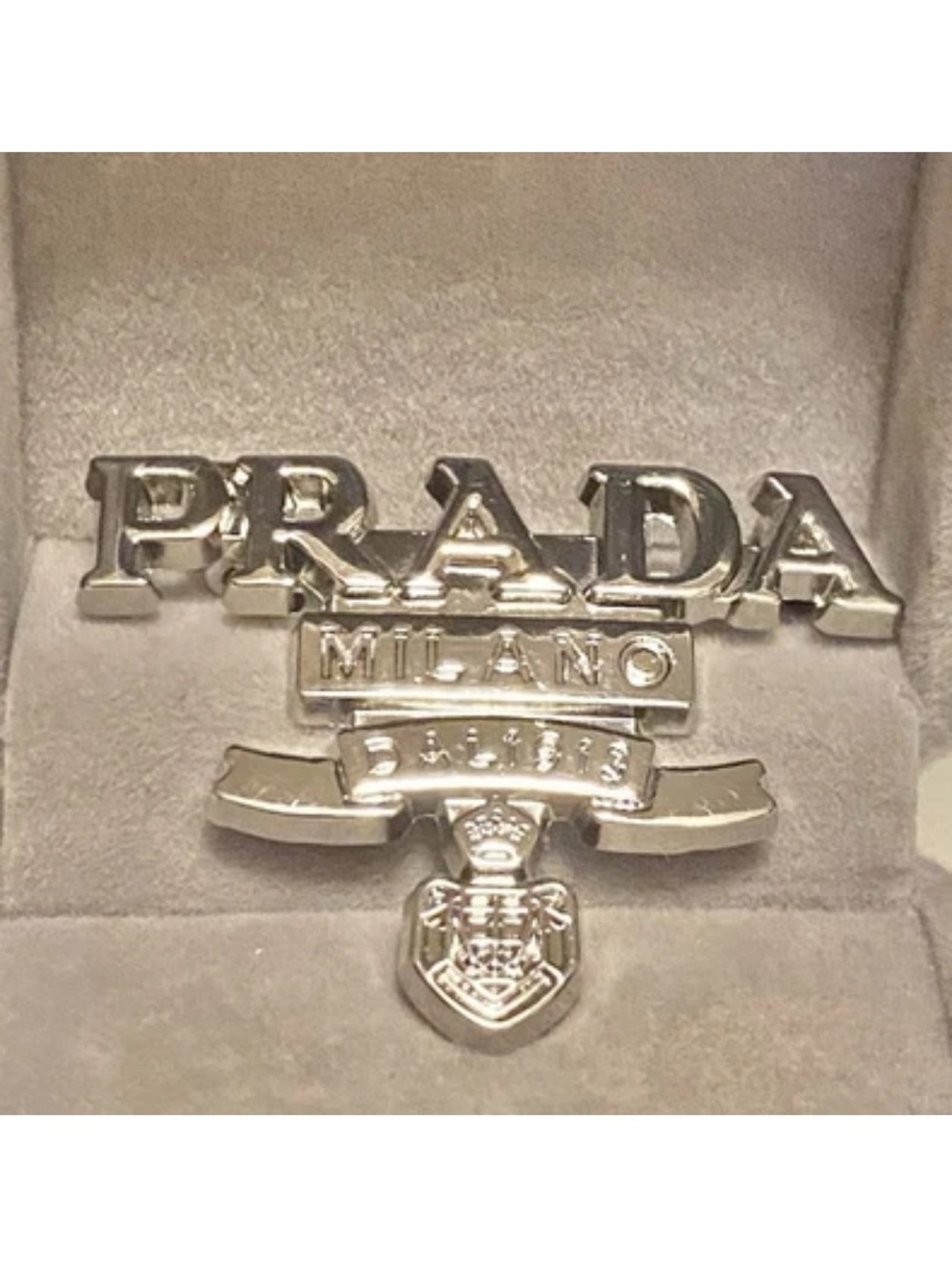 Prada Silver Tone Milano Crest Brooch unisex